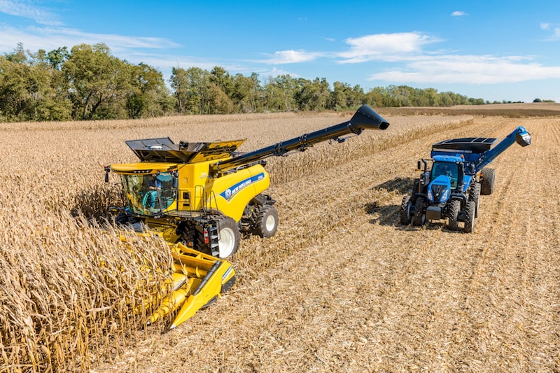 New Holland agriculture equipment harvesting corn