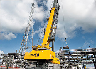 Grove Crane moving pieces at a job site